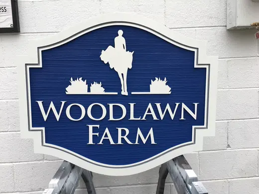 Woodlawn Farm blue and white dimensional sign